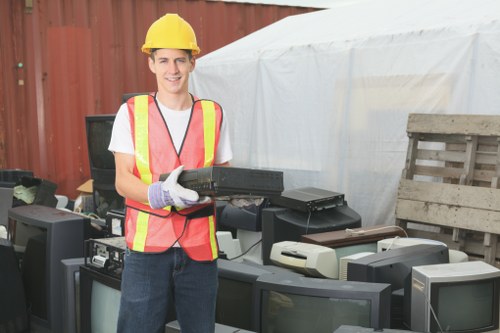 Bulk waste collection vehicle unloading furniture
