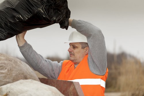Workers managing construction waste